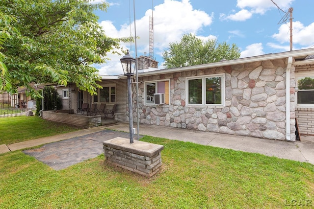 753 Vaniman Island Dr, Brooklyn, MI 49230 - single story home featuring stone siding and a patio area