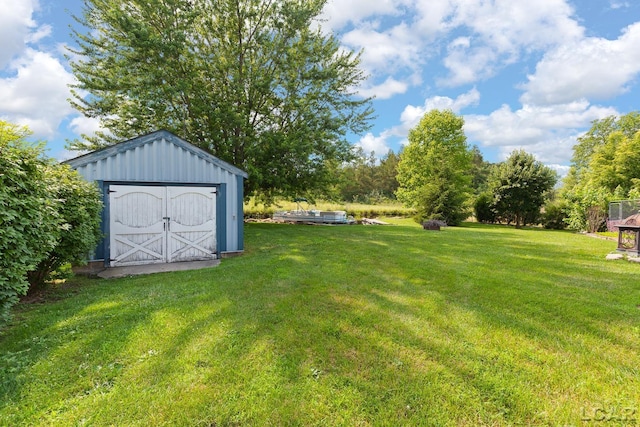 753 Vaniman Island Dr, Brooklyn, MI 49230 - view of green lawn featuring a storage shed
