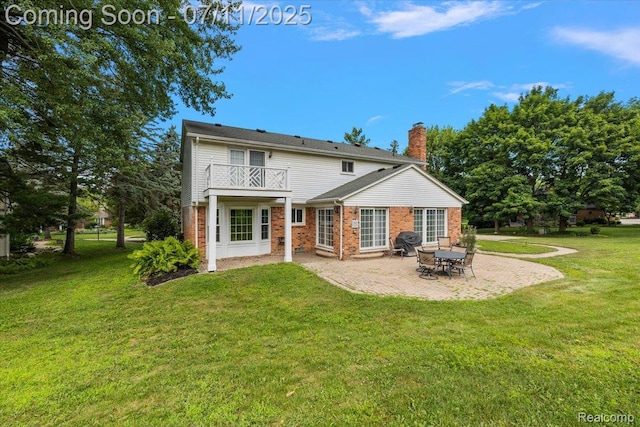 2403 Red Maple Ct, Troy, MI 48098 - back of property featuring a patio, a chimney, a yard, brick siding, and a balcony
