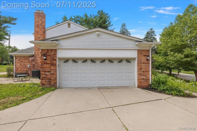 2403 Red Maple Ct, Troy, MI 48098 - view of property exterior with brick siding, driveway, a chimney, and an attached garage