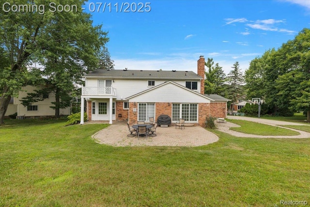 2403 Red Maple Ct, Troy, MI 48098 - back of house featuring a balcony, a patio area, a lawn, and brick siding