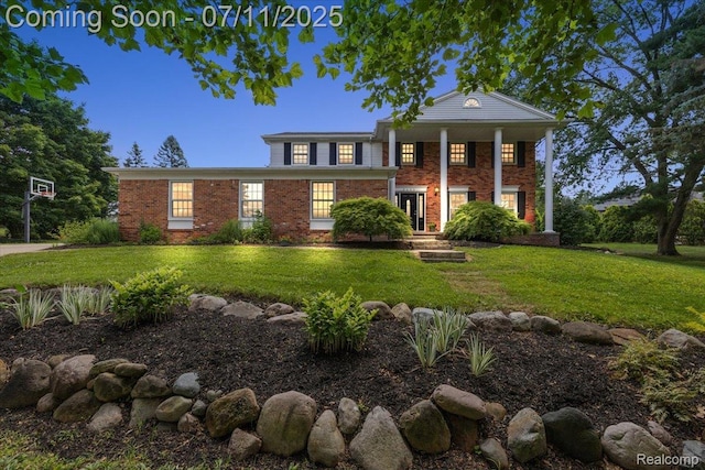 2403 Red Maple Ct, Troy, MI 48098 - neoclassical home featuring a front lawn and brick siding