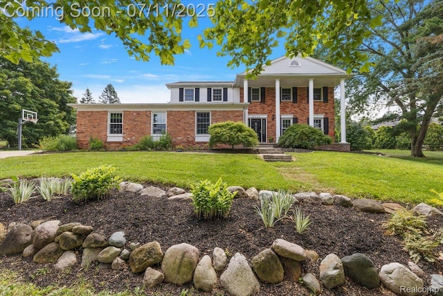 2403 Red Maple Ct, Troy, MI 48098 - greek revival house featuring brick siding and a front lawn