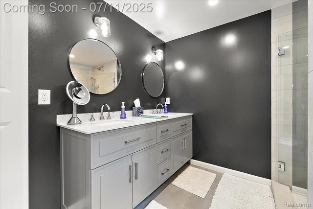 2403 Red Maple Ct, Troy, MI 48098 - bathroom with double vanity, tiled shower, and tile patterned floors