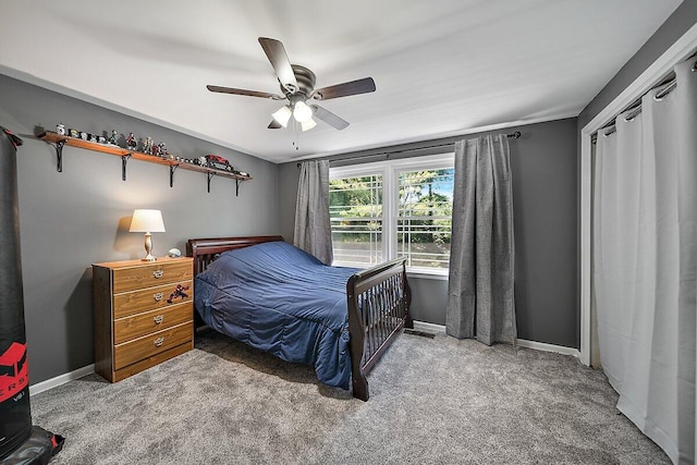 4550 Comanche Dr, Okemos, MI 48864 - carpeted bedroom with baseboards and a ceiling fan