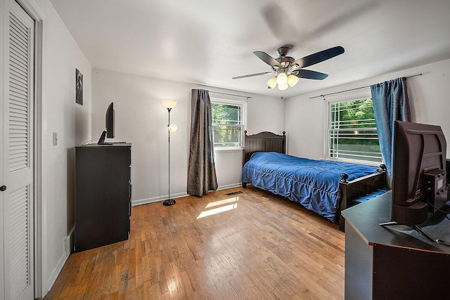 4550 Comanche Dr, Okemos, MI 48864 - bedroom featuring wood finished floors and ceiling fan