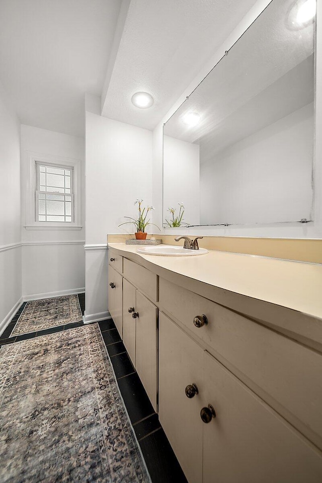 4550 Comanche Dr, Okemos, MI 48864 - bathroom with vanity and tile patterned floors
