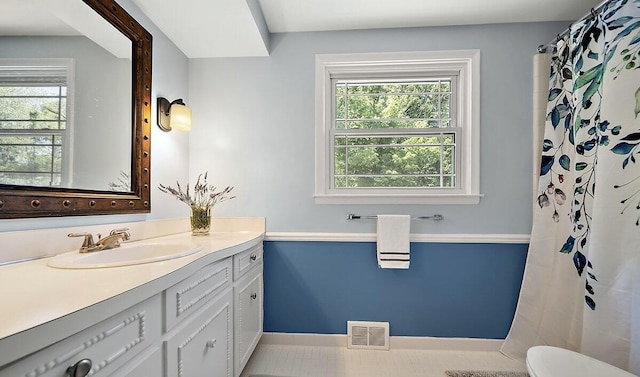 4550 Comanche Dr, Okemos, MI 48864 - bathroom featuring vanity and a shower with shower curtain