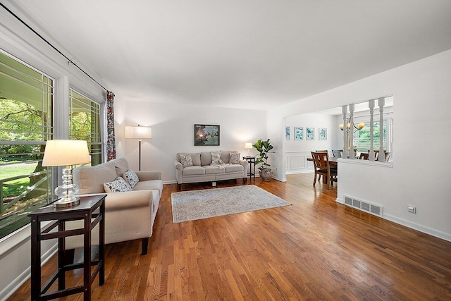 4550 Comanche Dr, Okemos, MI 48864 - living room with a chandelier and wood finished floors