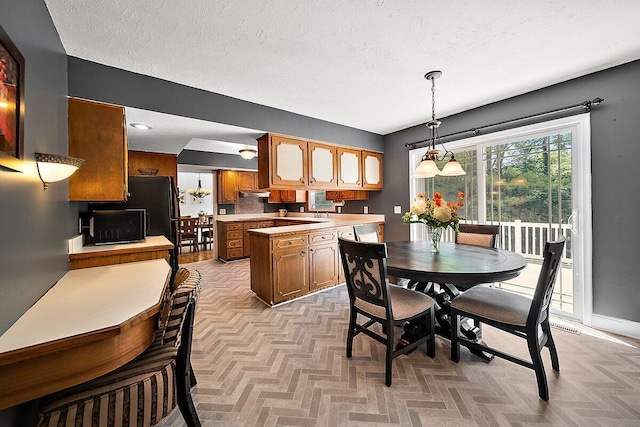 4550 Comanche Dr, Okemos, MI 48864 - dining room featuring a textured ceiling