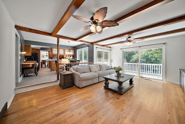 4550 Comanche Dr, Okemos, MI 48864 - living room with light wood finished floors, beam ceiling, and ceiling fan