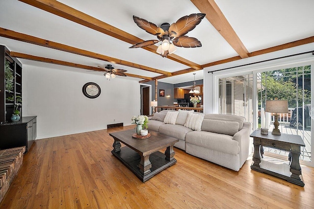 4550 Comanche Dr, Okemos, MI 48864 - living room featuring beamed ceiling, ceiling fan, and light wood finished floors
