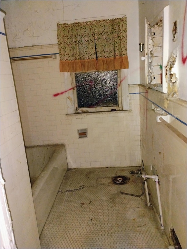 3203 Buena Vista St, Detroit, MI 48238 - full bathroom featuring a bath, tile walls, and a wainscoted wall