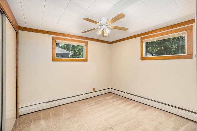 193 S Emerson Dr, Branch, MI 49402 - spare room with light colored carpet, baseboard heating, and a ceiling fan