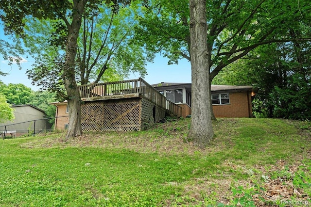 1540 Milford Hills Dr, Milford, MI 48381 - back of property with a wooden deck, brick siding, and stairway