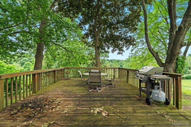 1540 Milford Hills Dr, Milford, MI 48381 - wooden terrace with grilling area and outdoor dining area