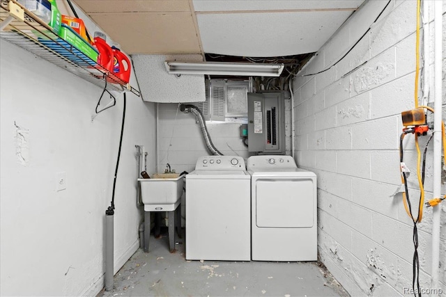 1540 Milford Hills Dr, Milford, MI 48381 - laundry room featuring electric panel, washing machine and clothes dryer, and concrete block wall
