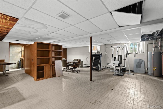 1540 Milford Hills Dr, Milford, MI 48381 - below grade area featuring water heater, brick patterned floors, a paneled ceiling, and a baseboard radiator