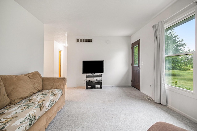 3128 Maurer Rd, Charlotte, MI 48813 - living area featuring light colored carpet and baseboards