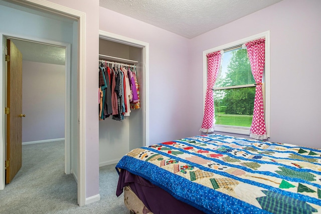 3128 Maurer Rd, Charlotte, MI 48813 - carpeted bedroom featuring a textured ceiling and a closet