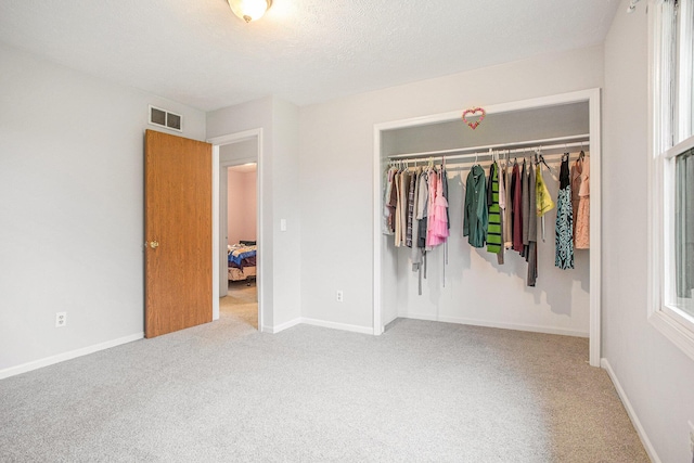 3128 Maurer Rd, Charlotte, MI 48813 - unfurnished bedroom featuring carpet flooring and a closet