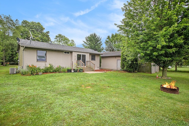 3128 Maurer Rd, Charlotte, MI 48813 - single story home featuring a fire pit and a front yard