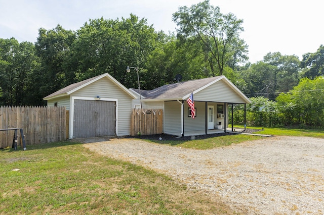 1620 Ontario Rd, Niles, MI 49120 - view of front of house featuring a porch, driveway, a garage, and view of scattered trees