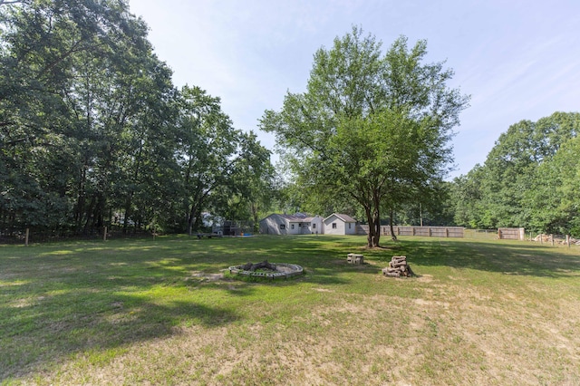 1620 Ontario Rd, Niles, MI 49120 - view of yard featuring an outdoor fire pit and view of wooded area