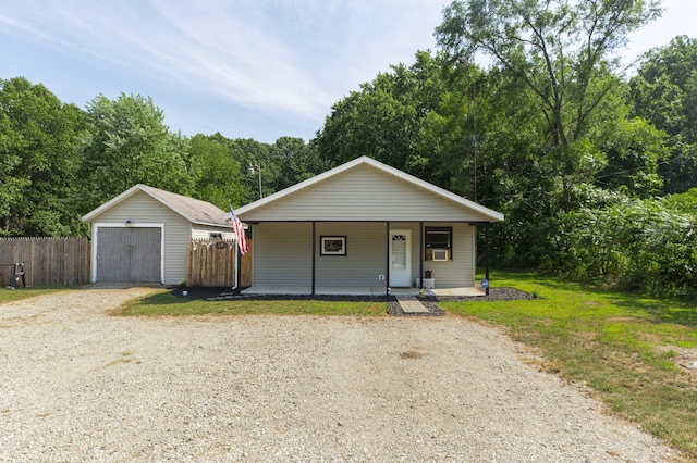 1620 Ontario Rd, Niles, MI 49120 - bungalow-style house with an outbuilding, covered porch, a detached garage, and driveway