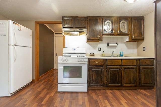 1620 Ontario Rd, Niles, MI 49120 - kitchen with white appliances, exhaust hood, dark wood-type flooring, light countertops, and a textured ceiling