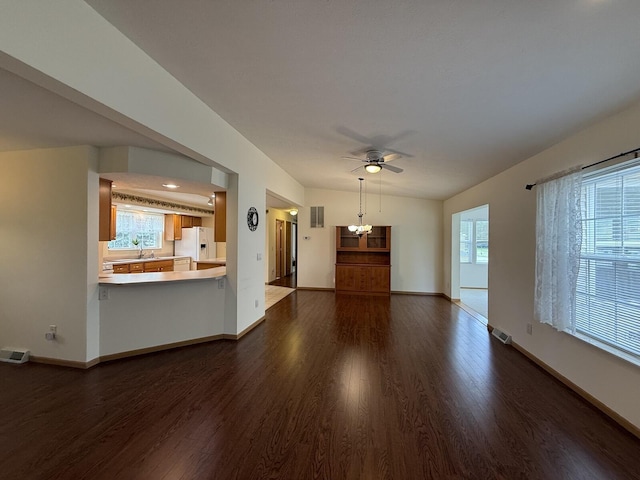 7826 Sunset Shores Dr Unit 43, Canadian Lakes, MI 49346 - unfurnished living room with dark wood-type flooring and a ceiling fan