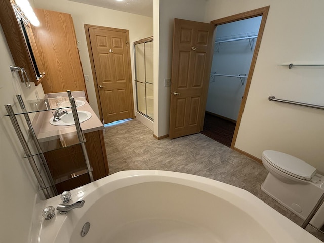 7826 Sunset Shores Dr Unit 43, Canadian Lakes, MI 49346 - bathroom featuring vanity, a shower stall, a bath, and a spacious closet