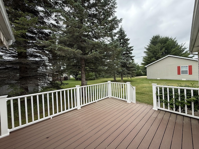7826 Sunset Shores Dr Unit 43, Canadian Lakes, MI 49346 - wooden deck featuring a yard