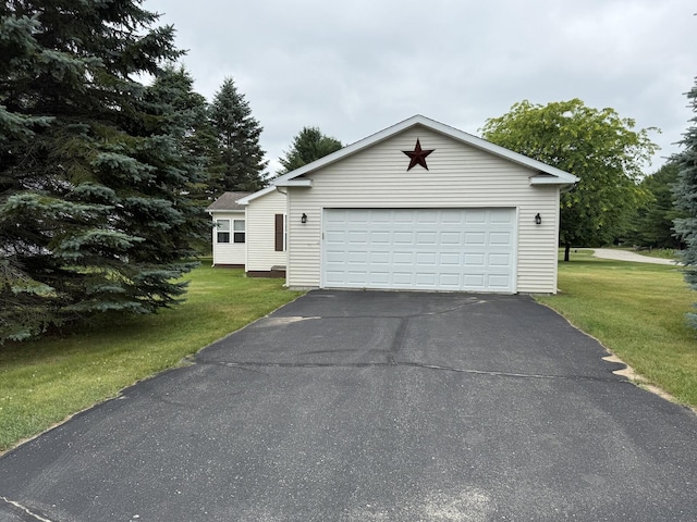 7826 Sunset Shores Dr Unit 43, Canadian Lakes, MI 49346 - view of front of property with a front yard and a detached garage