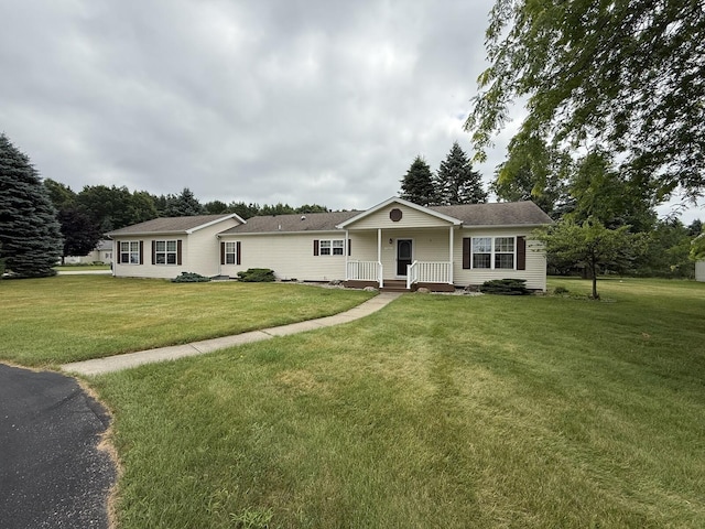 7826 Sunset Shores Dr Unit 43, Canadian Lakes, MI 49346 - ranch-style home with a front lawn and covered porch