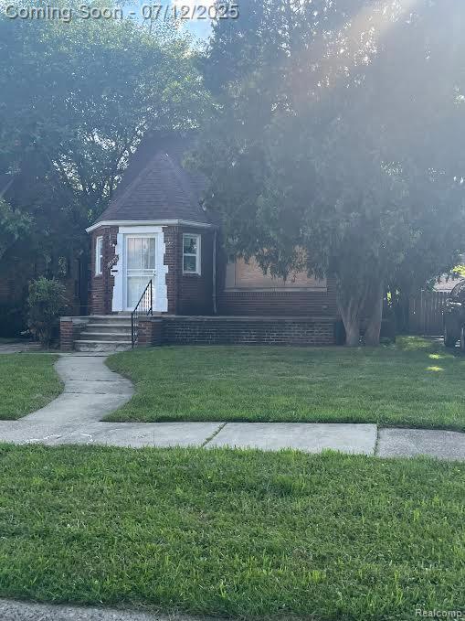 15475 Prest St, Detroit, MI 48227 - view of front of property with a front yard and brick siding
