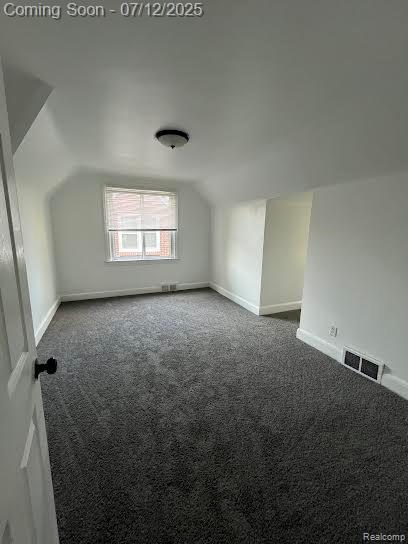 15475 Prest St, Detroit, MI 48227 - additional living space featuring vaulted ceiling and carpet floors