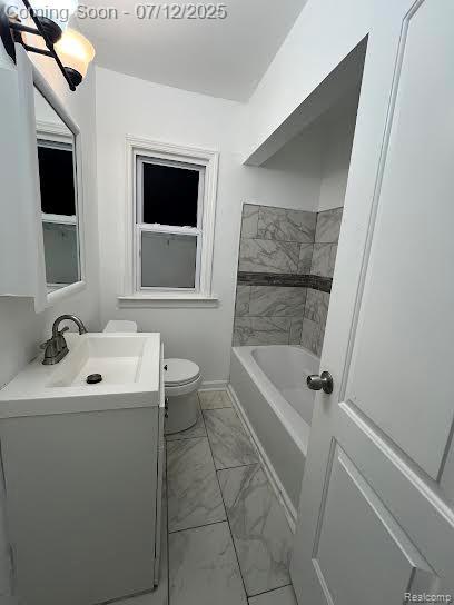 15475 Prest St, Detroit, MI 48227 - bathroom featuring marble look tiles and vanity