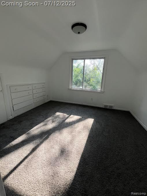 15475 Prest St, Detroit, MI 48227 - bonus room featuring dark carpet and vaulted ceiling