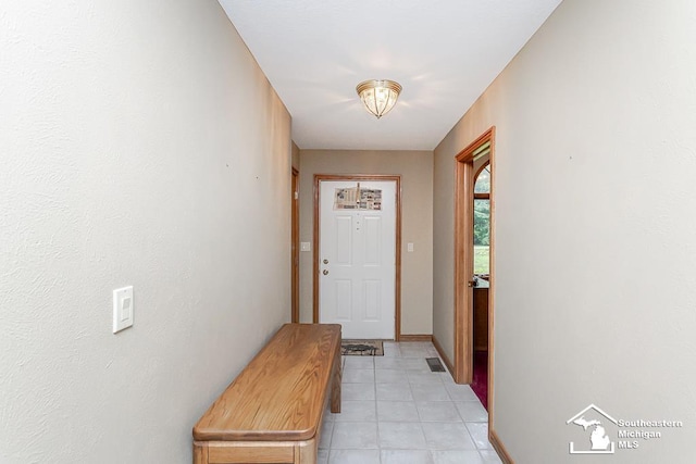5237 Emerson Dr, Ottawa Lake, MI 49267 - doorway featuring light tile patterned floors and baseboards