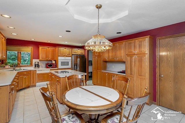 5237 Emerson Dr, Ottawa Lake, MI 49267 - kitchen featuring white appliances, a chandelier, light tile patterned flooring, light countertops, and recessed lighting