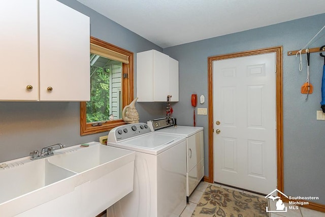 5237 Emerson Dr, Ottawa Lake, MI 49267 - washroom featuring cabinet space, washer and dryer, and light tile patterned flooring