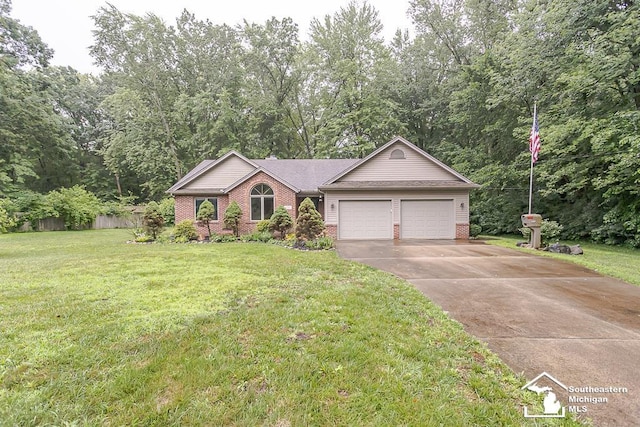 5237 Emerson Dr, Ottawa Lake, MI 49267 - ranch-style house with brick siding, a garage, concrete driveway, and a front yard