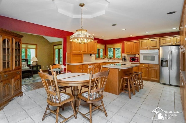 5237 Emerson Dr, Ottawa Lake, MI 49267 - dining room with a chandelier, plenty of natural light, light tile patterned floors, and recessed lighting