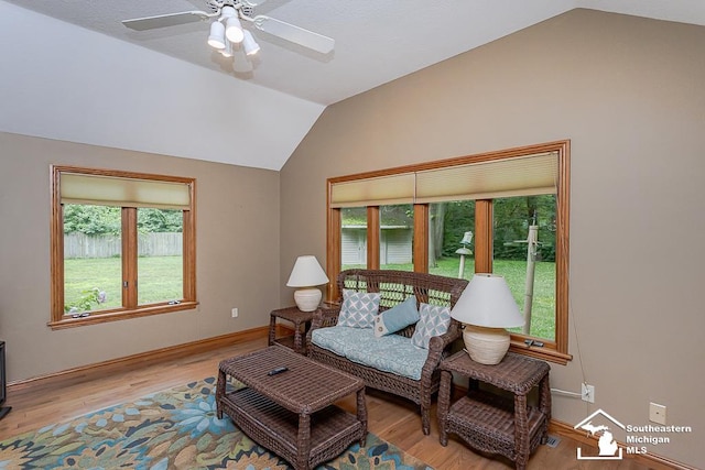 5237 Emerson Dr, Ottawa Lake, MI 49267 - living area with vaulted ceiling, light wood-style flooring, and a ceiling fan