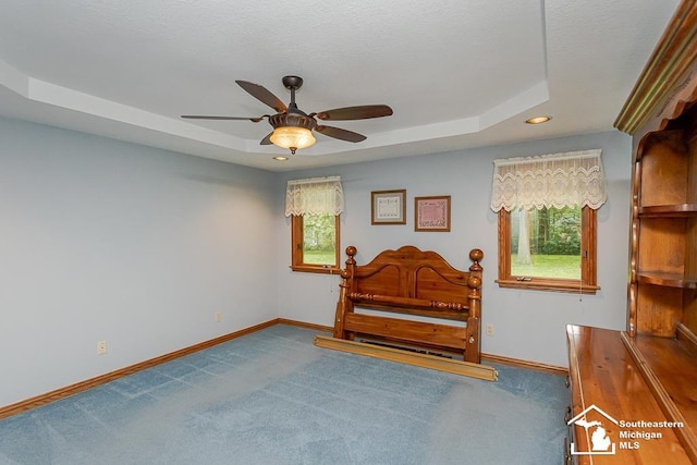 5237 Emerson Dr, Ottawa Lake, MI 49267 - carpeted bedroom with a tray ceiling, recessed lighting, and ceiling fan