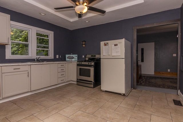 1228 Wells Pl, Kalamazoo, MI 49001 - kitchen with stainless steel appliances, light countertops, white cabinetry, ceiling fan, and recessed lighting