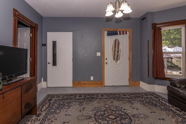 1228 Wells Pl, Kalamazoo, MI 49001 - entryway with baseboards and a chandelier