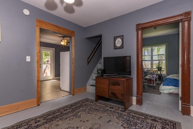 1228 Wells Pl, Kalamazoo, MI 49001 - living area featuring a ceiling fan, healthy amount of natural light, and stairs