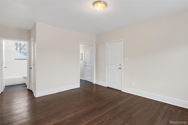 8451 Navy St, Detroit, MI 48209 - spare room featuring dark wood-style flooring